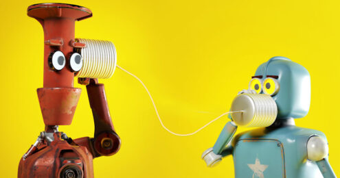 executive session - a tall slender brown robot and a short square light blue robot talking to each other through two cans and a string against a yellow background