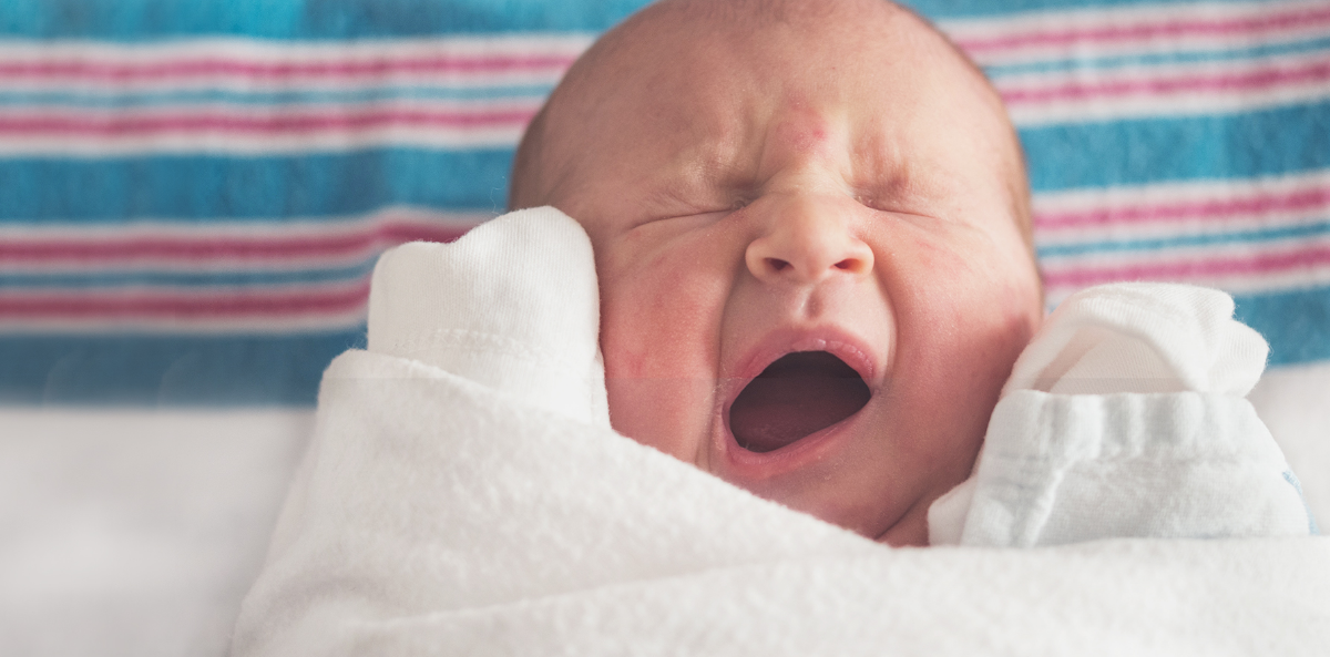 A yawning baby representing boring board meetings.