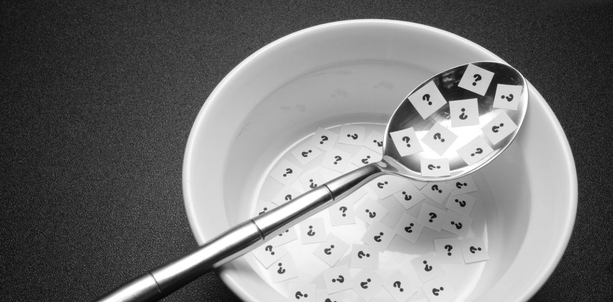 A bowl full of question marks on tiny slips of paper, signifying the hidden ingredient of a high functioning board.